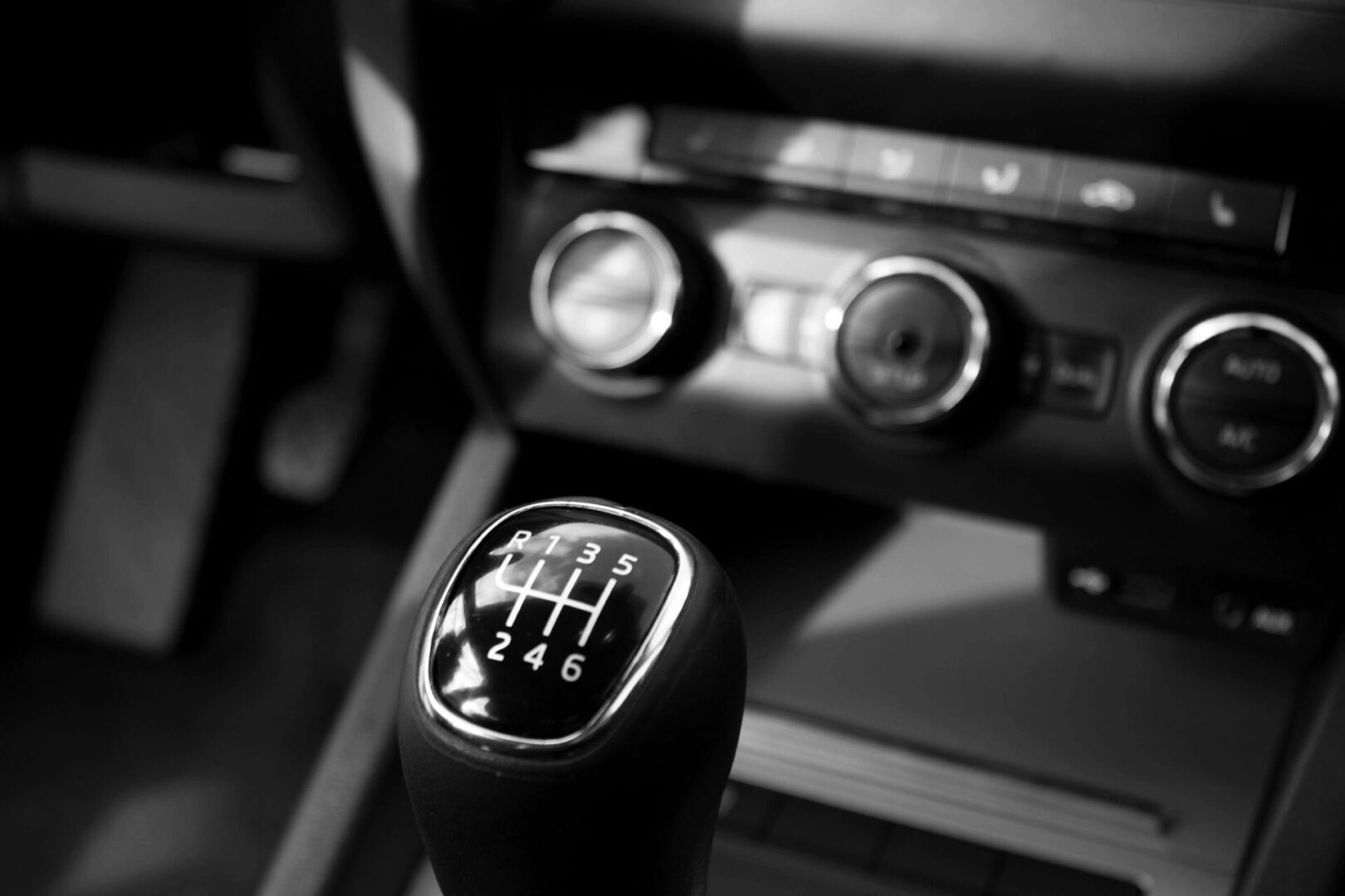 A close up of the shift knob in a car