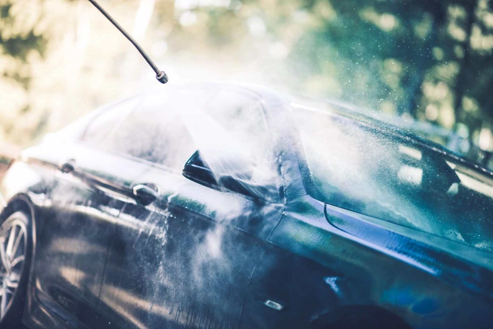 A car that is blowing steam from the hood.