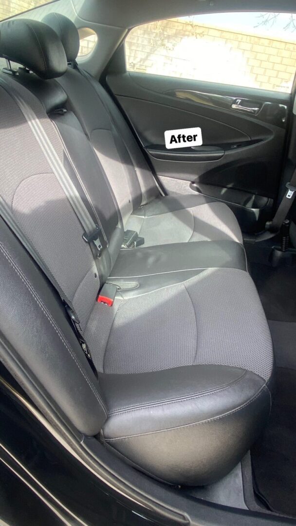 A back seat of a car after cleaning.