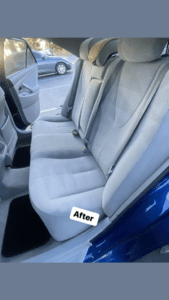 A back seat of a car after cleaning.